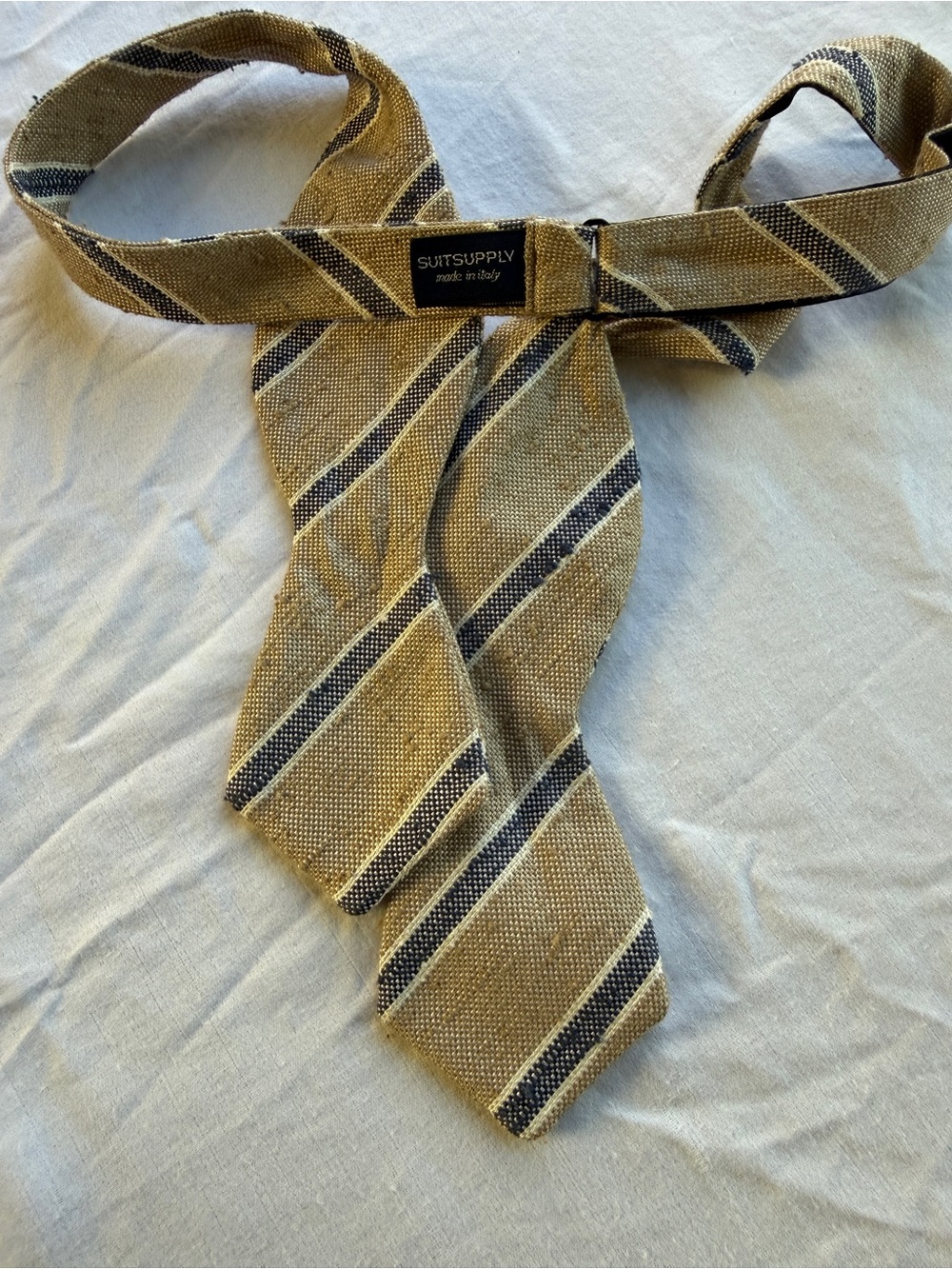 Suitsupply 100% Silk Adjustable Bow Tie
Made in Italy Beige & Blue Striped